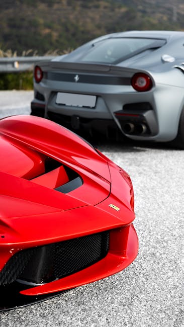 Stylish red and silver luxury sports cars parked outdoors, showcasing sleek design.